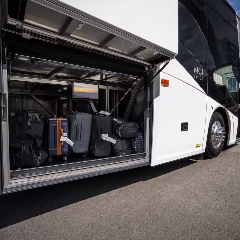 Party bus interior with wraparound leather seating and LED lighting in New Orleans