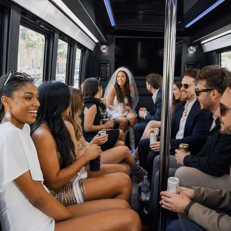 Party bus interior with wraparound leather seating and LED lighting in New Orleans