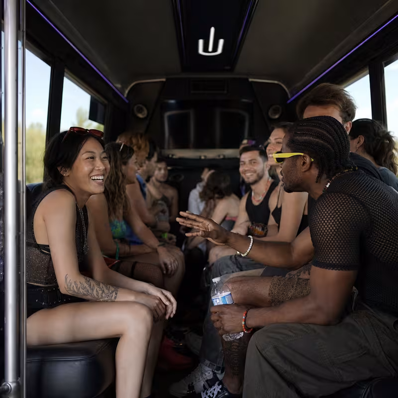 Passengers loading luggage while boarding an New Orleans group shuttle