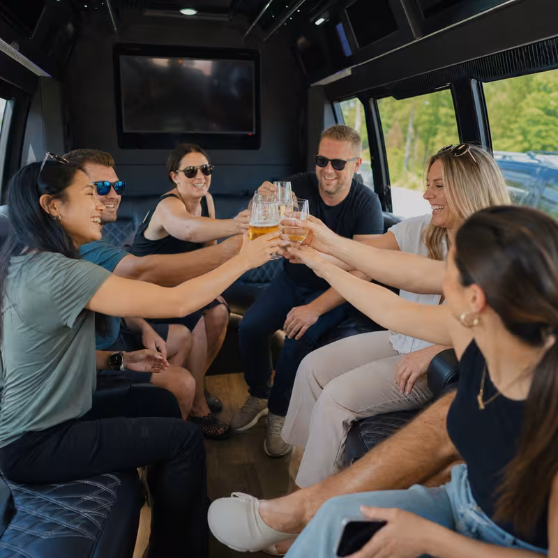 Group boarding a white charter bus for Winery & Brewery Tour Transportation transportation in New Orleans