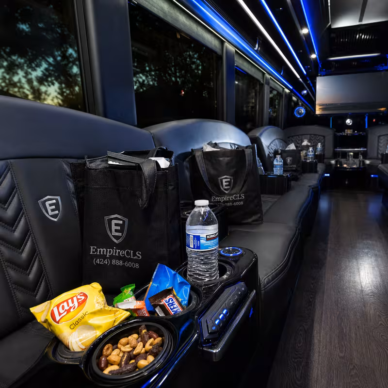 Party bus interior with wraparound leather seating and LED lighting in New Orleans