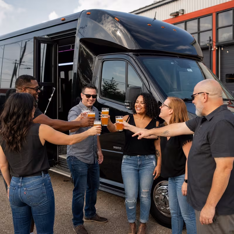 Passengers loading luggage while boarding an New Orleans group shuttle